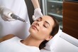 A skilled esthetician focuses on applying a precise chemical peel treatment, aiming to rejuvenate the client's skin in a modern, well-equipped treatment room.