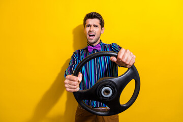 Sticker - Photo of astonished man dressed striped shirt bow tie hold steering wheel staring at accident isolated on vivid yellow color background