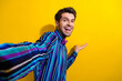 © deagreez - Photo of nice man dressed striped shirt bow tie palm presenting product empty space on selfie isolated on vivid yellow color background