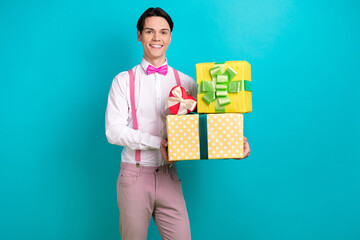 Sticker - Photo portrait of attractive young man hold pile presents boxes celebration wear trendy pink clothes isolated on cyan color background