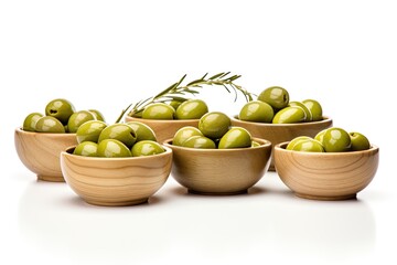 Wall Mural - Wooden bowls with green olives isolated on a white background