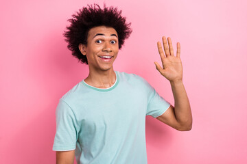 Poster - Photo portrait of nice young guy waving hand excited greeting dressed stylish blue outfit isolated on pink color background