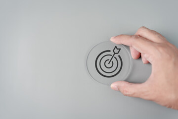 Leinwandbilder - Hand holding Target icon which for planning development leadership and customer target group concept.