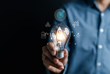Aufkleber - Rocket launch idea inside lightbulb with arrows up. strategically planning and initiating a corporate startup. aim to achieve objectives through value development, fostering leadership.
