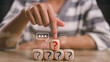 © FAMILY STOCK - Businesswoman touching wooden arranging cube with question mark icon. Q and A concept. frequently asked questions concepts in websites, social networks, and business issues. Recommendation