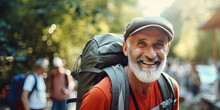 Smiling Elderly Man With Backpack Travels And Discovers New Places And Cultures. Happy Retirement, Travel, Vacation, Trip, Healthy Active Lifestyle