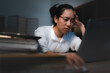 © chokniti - Late-night freelancer, Dedicated Asian woman working overtime on laptop computer, meeting deadlines in the sleepy Night, Businesswoman burning the midnight to working hard, sleep at working desk