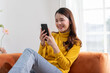 © 220 Selfmade studio - Happiness Entrepreneur beautiful business asian young woman wear casual use mobile phone for shopping online enjoy with social media and laptop at home.Small Business Startup.online banking