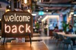 © Dusit - A business office with the text welcome back in a big classy font in the foreground. Generative AI.