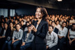 Asian, oriental, Chinese, Japanese, Korean speaker presenting to a business audience, at a crowded conference, voicing her opinion
