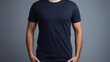 A person in navy blue t shirt over dark background