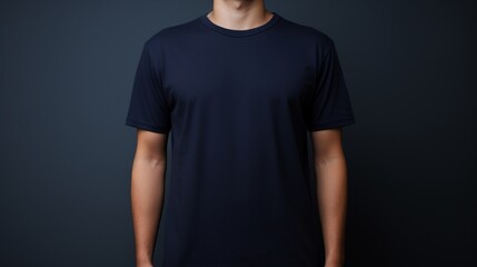 A person wearing navy blue t shirt isolated on dark background