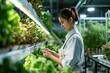 A determined female in a vertical farm, her gaze fixed on her tablet as she walks the line between agricultural tradition and the frontier of plant cultivation technology.