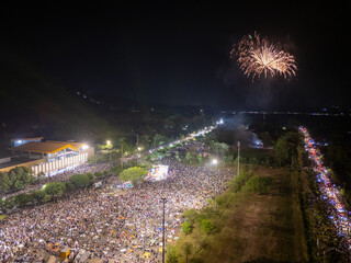 Wall Mural - Celebration. Skyline with fireworks light up sky in Ba Den mountain, Tay Ninh city, Vietnam. Beautiful night view cityscape. Holidays, celebrating New Year and Tet holiday