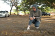 © ArvStd - Joint pain, Arthritis and tendon problems. an asian muslim woman touching knee at pain point in the park.