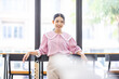 © David - Portrait of smiling asian girl in holiday or day off posing in cafe, looking confident and stylish.