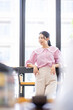 © David - Portrait of smiling asian girl in holiday or day off posing in cafe, looking confident and stylish.
