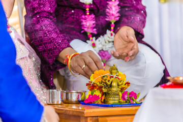 Indian Hindu wedding ceremony Ganesh pooja rituals close ups