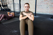 © Flamingo Images - Woman doing sit-ups during a gym class