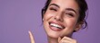 © vxnaghiyev - dental health beauty hygiene and people concept close up of smiling woman face pointing to teeth over violet background. with copy space image. Place for adding text or design