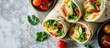 Chicken wraps with avocado tomatoes and iceberg lettuce Tortilla burritos sandwiches twisted rolls View from above top. with copy space image. Place for adding text or design