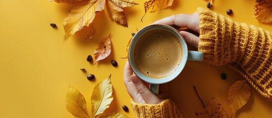 Aufkleber - Autumn composition Cup of coffee and with woman s hand yellow sweater on pastel yellow background Autumn fall concept Flat lay top view copy space. with copy space image