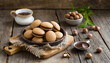 Baci di dama italian hazelnut biscuits cookies with chocolate cream, rustic style