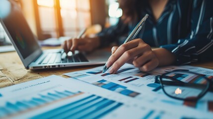 Poster - hands of businesswoman examining graph at desk,financial advisor and accounting concept