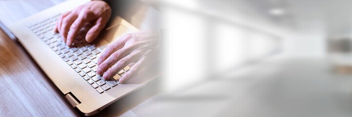 Canvas Print - Hands typing on laptop keyboard; panoramic banner