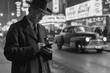 a vintage black and white photo from the 50's of a man using a phone at street