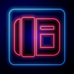 Poster - Glowing neon Telephone handset icon isolated on black background. Phone sign.  Vector