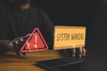 Poster - User is using computer with triangle caution warning sign for notification error and maintenance concept. Hacker attacks and hacking data, cyber crime, Ransomware, Phishing, Spyware, cybersecurity.