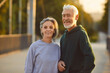 © Studio Romantic - Portrait of active senior happy smiling couple family standing in city park after doing workout in nature or jogging exercises. Sport, fitness training in retirement and healthy lifestyle concept.