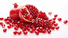 Arrangement Of Isolated Pomegranate Seeds On A White Canvas, Showcasing The Small And Vibrant Red Jewels Of This Antioxidant-rich Fruit.