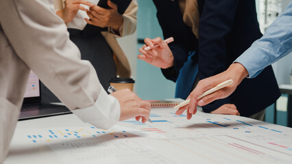 Wall Mural - Closeup happy young Asia businesspeople meeting brainstorming some new ideas about project to his partner working together planning success strategy enjoy teamwork in small modern home office.