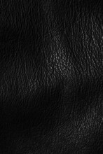 Black leather pattern texture. Abstract dark skin background, wavy rough skin