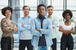 © Katsiaryna - a group of successful business diverse people in the office stands embracing