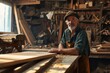 © Mr. Bolota - Master of Woodcraft: A Portrait of a Mature Male Artisan in His Carpentry Workshop, Showcasing the Artistry of Carpentry Work in the Background.