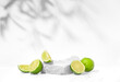 Beauty skin care product presentation podium and display made with porous stones and limes on white background. Studio photography.