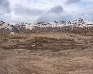 The Valley of Ten Thousand Smokes in Katmai National Park and Preserve in Alaska is filled with ash flow from Novarupta eruption in 1912. River eroding volcanic ash flow. Aerial view.