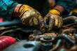A mechanic's greasy hands working tirelessly under the hood of a car, their expertise and effort ensuring safety and reliability for those who depend on their work.