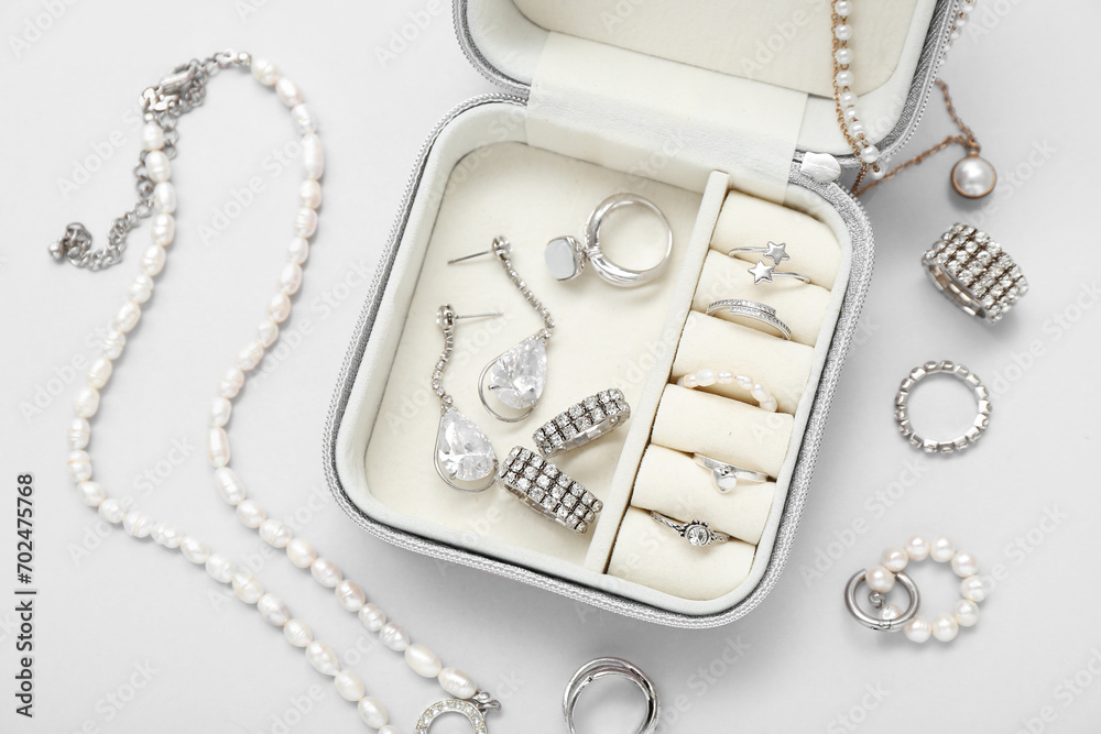 Organizer with stylish jewelry on white background