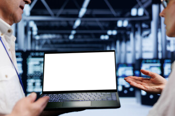 Poster - Close up shot of mock up laptop used by meticulous employee in cloud computing business server room delivering massive computational power, capable of processing and storing vast amounts of datasets