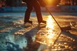 A person gracefully skating on an ice rink at sunset. Perfect for winter sports or recreational activities.