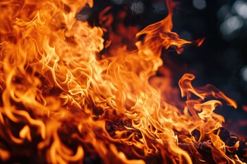 Poster - A close-up view of a burning fire. This image captures the intensity and beauty of the flames. It can be used to depict concepts such as warmth, energy, danger, or destruction