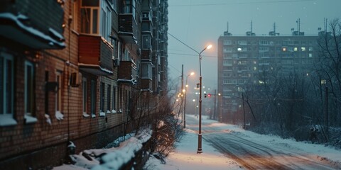 Poster - A snowy street in a city at night. Perfect for winter scenes and holiday-themed designs