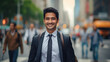 This image features a confident Asian Indian businessman in a suit, smiling as he walks through a busy city street on his way to the office, with the blurred street creating an urban vibe.