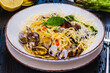 Italian food. Seafood pasta with clams. Spaghetti alle Vongole on white plate.