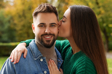 Poster - Happy young couple spending time together in autumn park