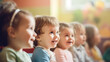 A row of delighted toddlers smiling and focusing intently during an entertaining puppet show performance.